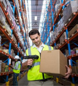 Man scanning a package in warehouse